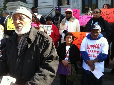 Peter Lamont, who voluntarily provides sick time to the three employees of his Newark printing company, Porta Print, spoke in support of mandatory sick pay during a rally this afternoon outside City Hall. Standing behind him to his left were Gertrudes Contreras and Derick Swaby, who said they do not receive sick pay as jet cabin cleaners at Newark Liberty International Airport.(Steve Strunsky/The Star-Ledger)